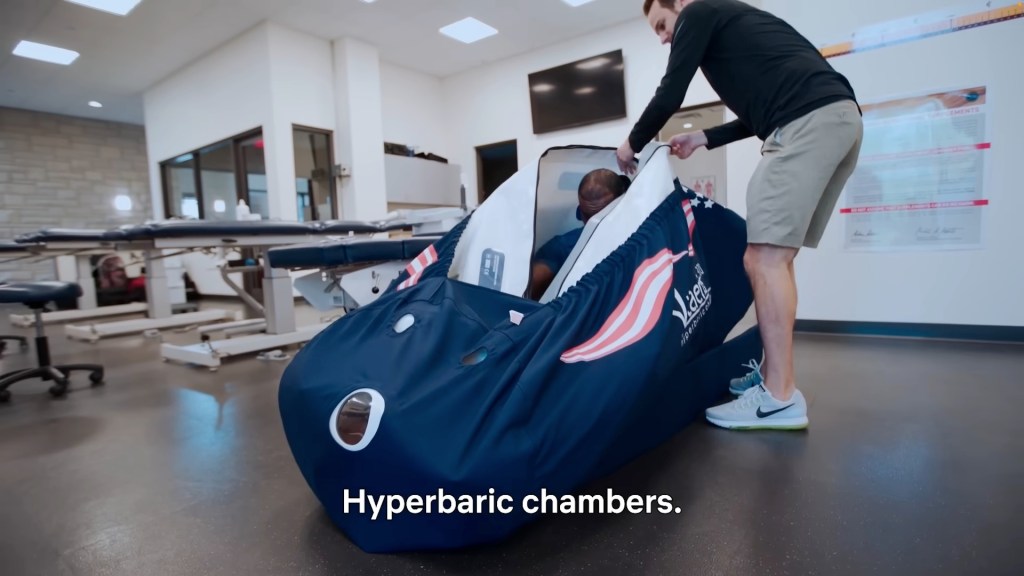 James climbs into a Vitaeris 320 Portable Hyperbaric Chamber.