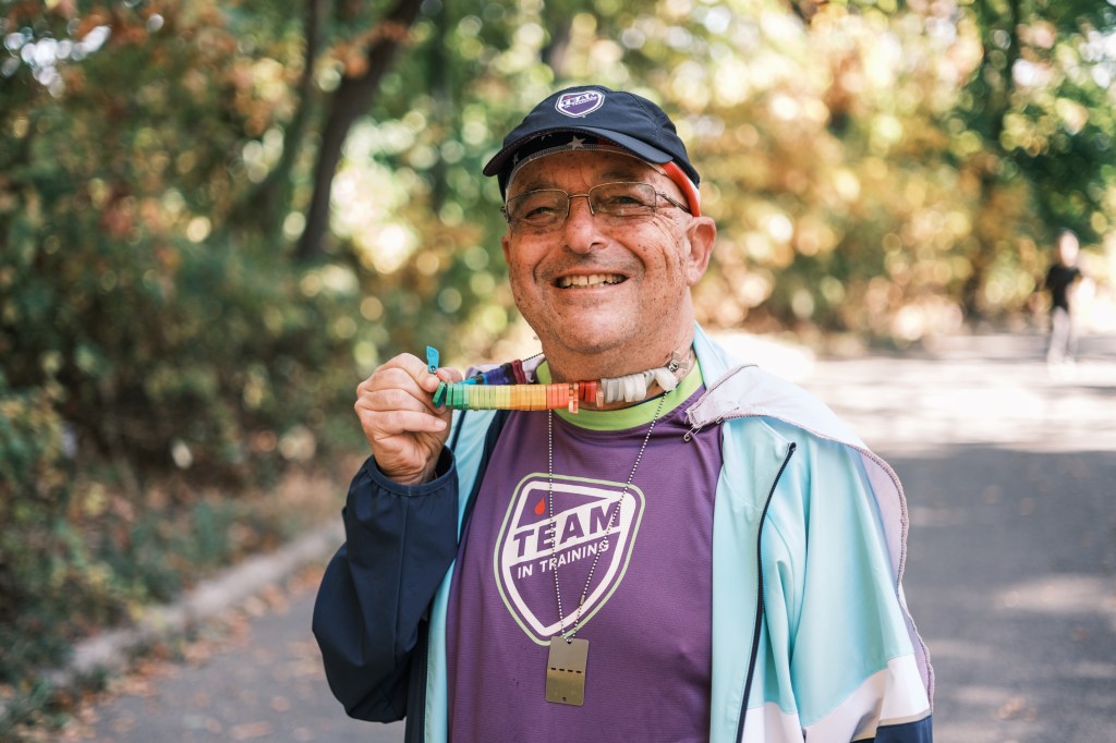 He also wears a necklace of colorful feet that celebrates his pal's recovery after a stem cell transplant.