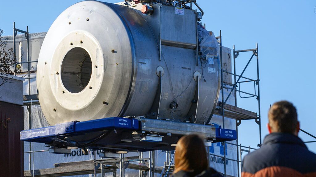 crane lifts a magnetic resonance tomograph