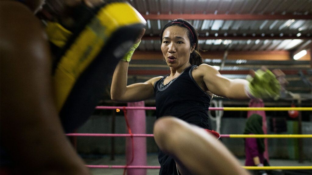 female kickboxer training in the ring