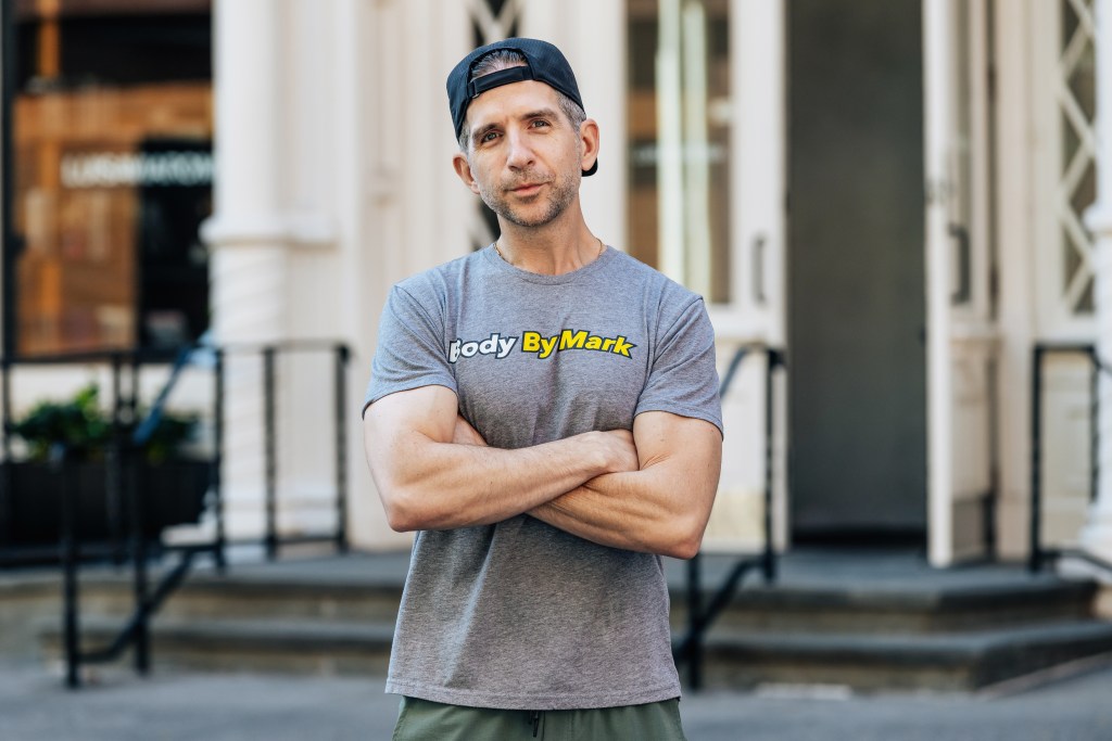 Mark Langowski standing outside with arms crossed.