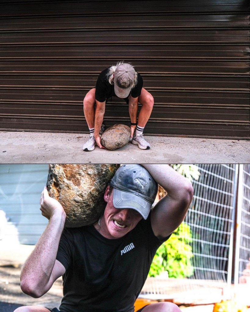 Nedd Brockmann lifting a rock at Sydney Olympic Park Athletic Centre for his 1000 miles run challenge to raise money for homelessness charity