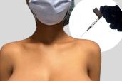 A 19-year-old woman's breasts stunningly grew from a B cup to a triple G in the six months following her Pfizer COVID-19 vaccination in what researchers are calling a first-of-its-kind case. Here, a woman wearing a mask is getting an injection.