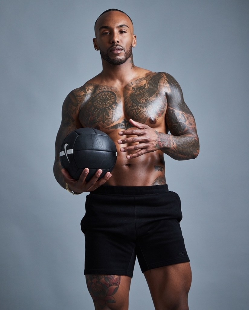 Fitness instructor Joseph David holds a ball.