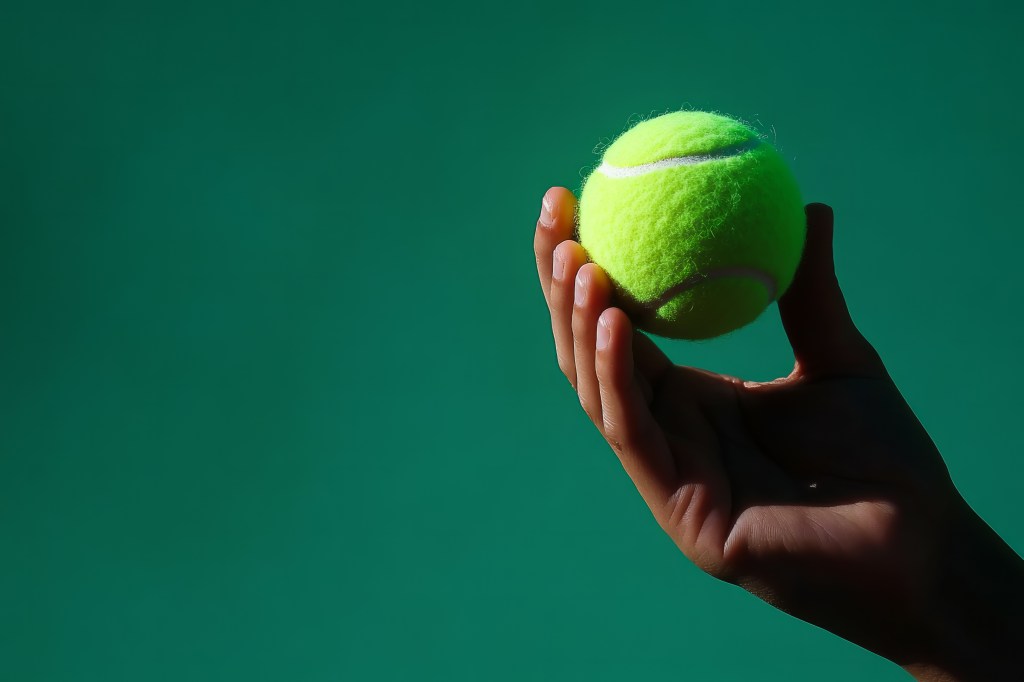 create-hyper-realistic-high-definition-103874698 Squeezing a tennis ball (pictured here) can help improve grip strength.